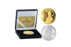 Gold and silver commemorative coins with a display box.