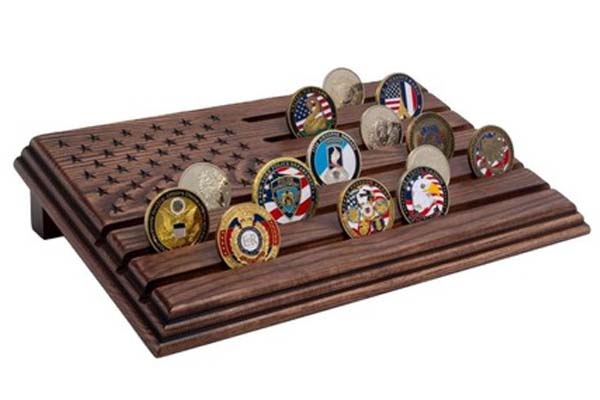 Wooden American flag coin display holding military challenge coins.