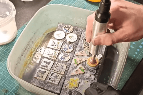 Polishing enamel pins using a rotary tool