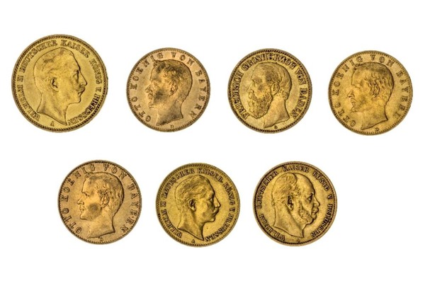 Gold German coins with historical portraits and inscriptions.