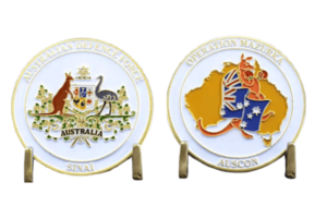 Australian Defence Force commemorative coins with national symbols.