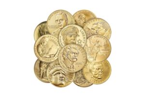 Gold commemorative coins with various historical figures and designs.